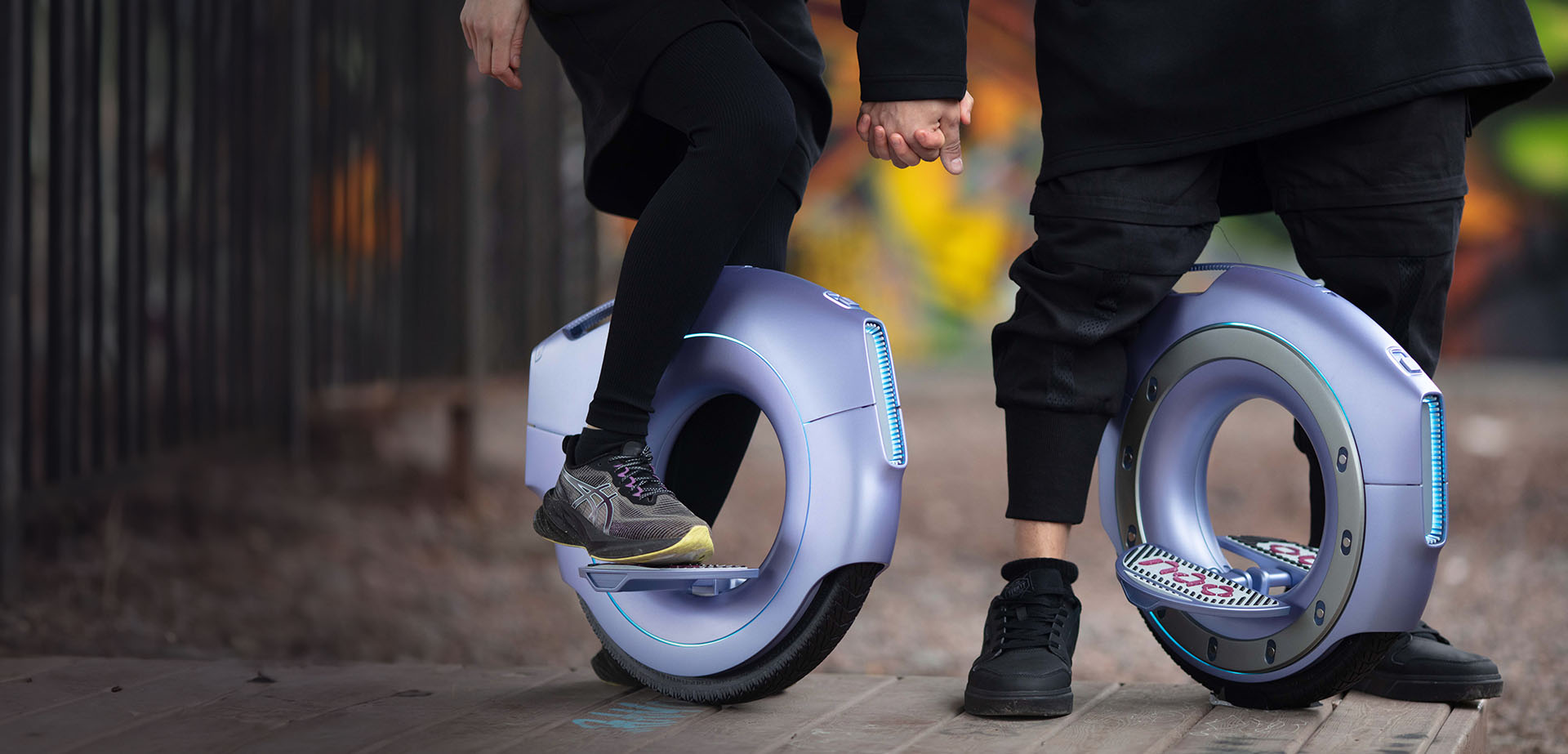 Atmotube PRO and Atmotube PLUS two air quality monitors on dark background flying in space 